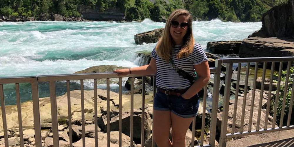 Chelsea Kinjorski poses in front of water.