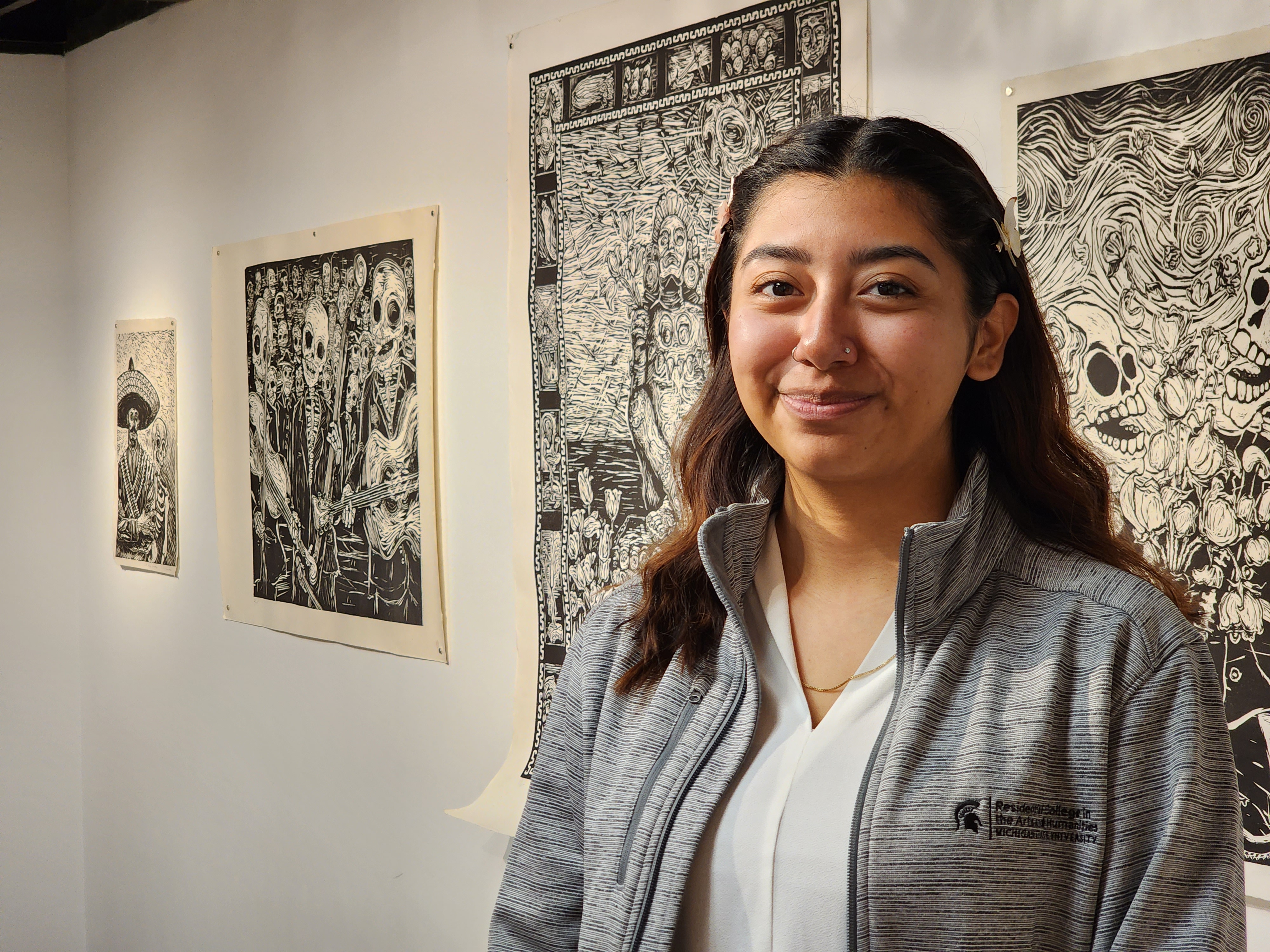 Alyssa Briones stand in the gallery