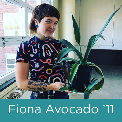 Image shows a young white woman with cropped brown hair holding a potted plant.