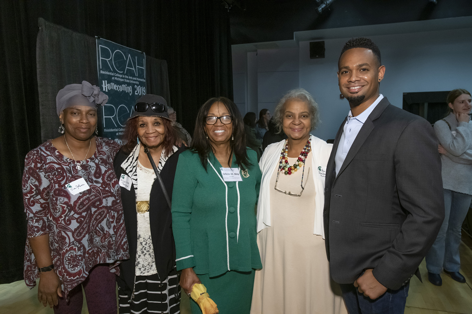 An African American family, Celeste M Moy and others, pose for a photo together.